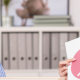 Boy with a mental health teacher showing him some posters